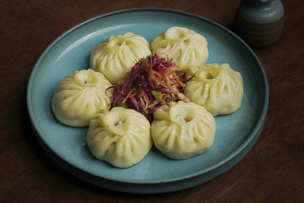 unsplash_GJyR7185kmI_steamed veg momos.jpg.jpg.webp