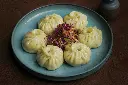 unsplash_GJyR7185kmI_steamed veg momos.jpg.jpg.webp