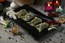unsplash_8nxJNNgodM4_steamed veg momos.webp