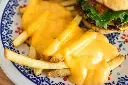 unsplash_6fPSFgNBAqs_cheese fries.jpg.jpg.webp