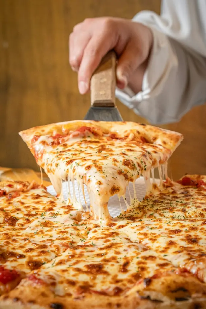 unsplash_Wwod6YKirbs_Double Cheese Pizza.webp